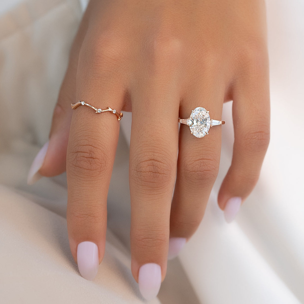 Oval cut CVD diamond three-stone engagement ring in white gold setting