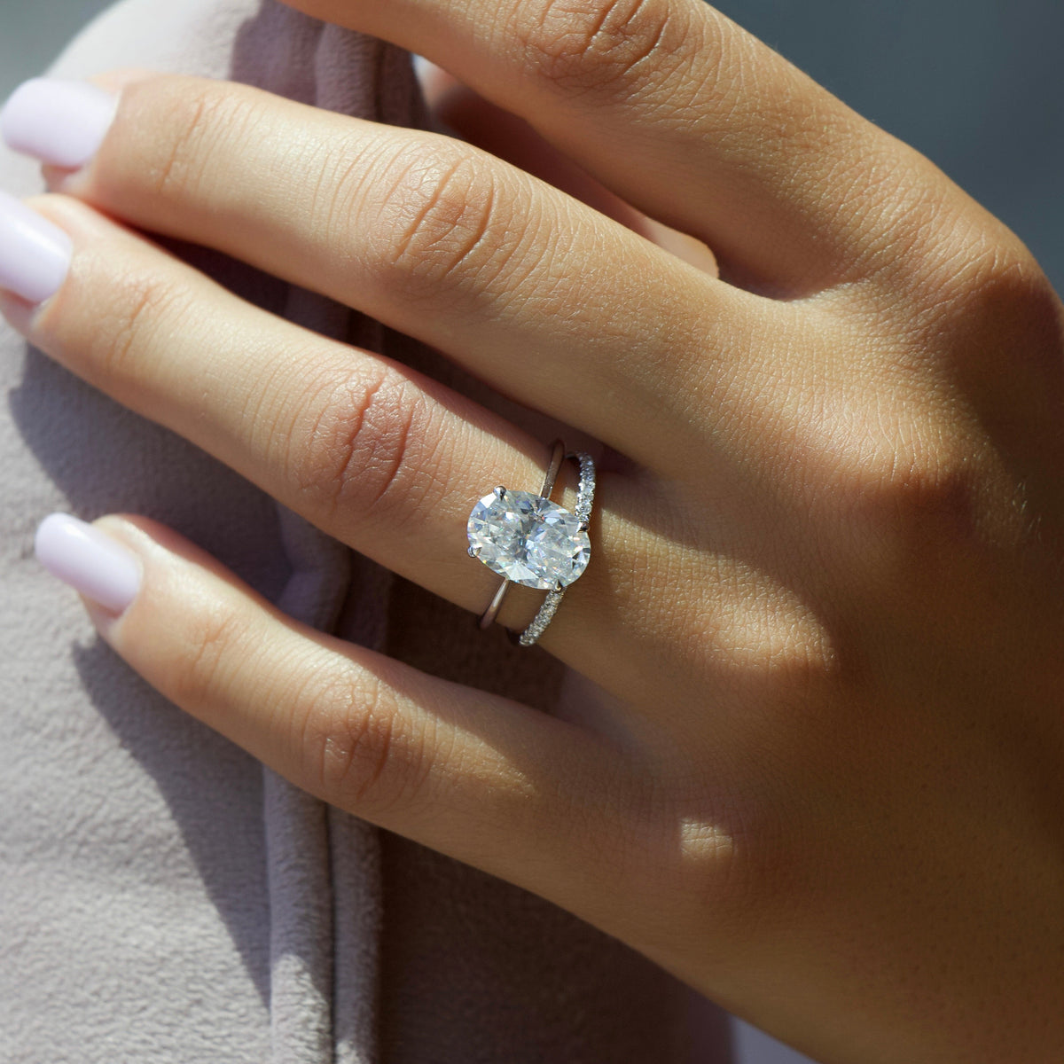 Oval cut CVD diamond engagement ring with hidden halo in white gold setting