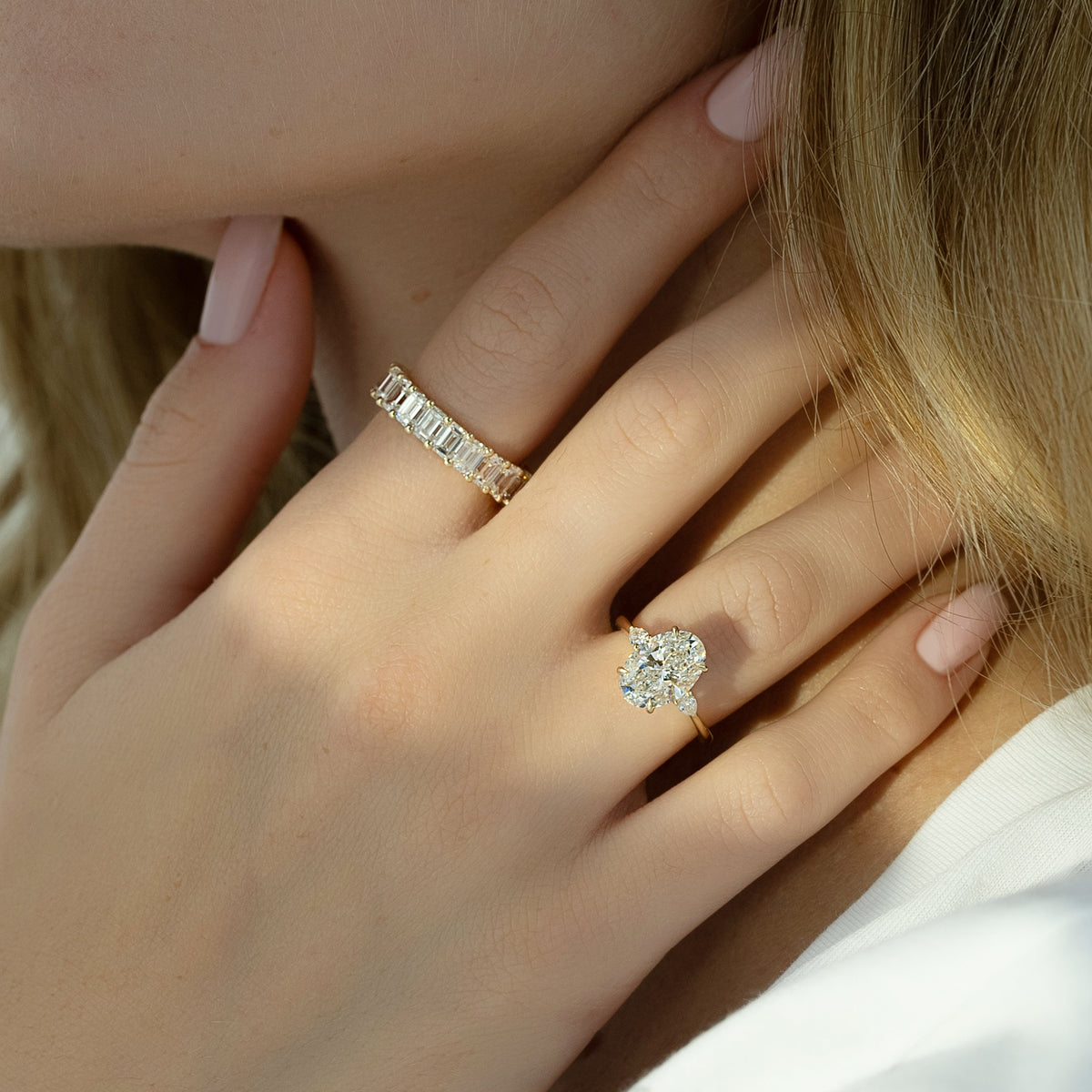 Oval cut CVD diamond three stone style engagement ring in platinum setting