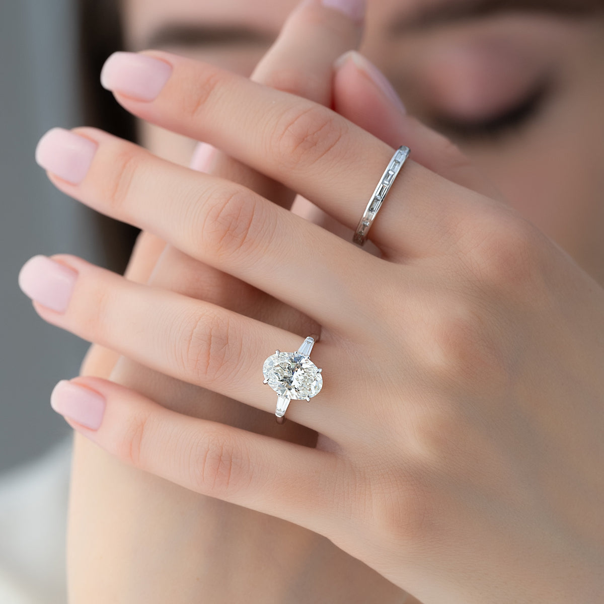 Oval cut CVD diamond three-stone engagement ring in white gold setting