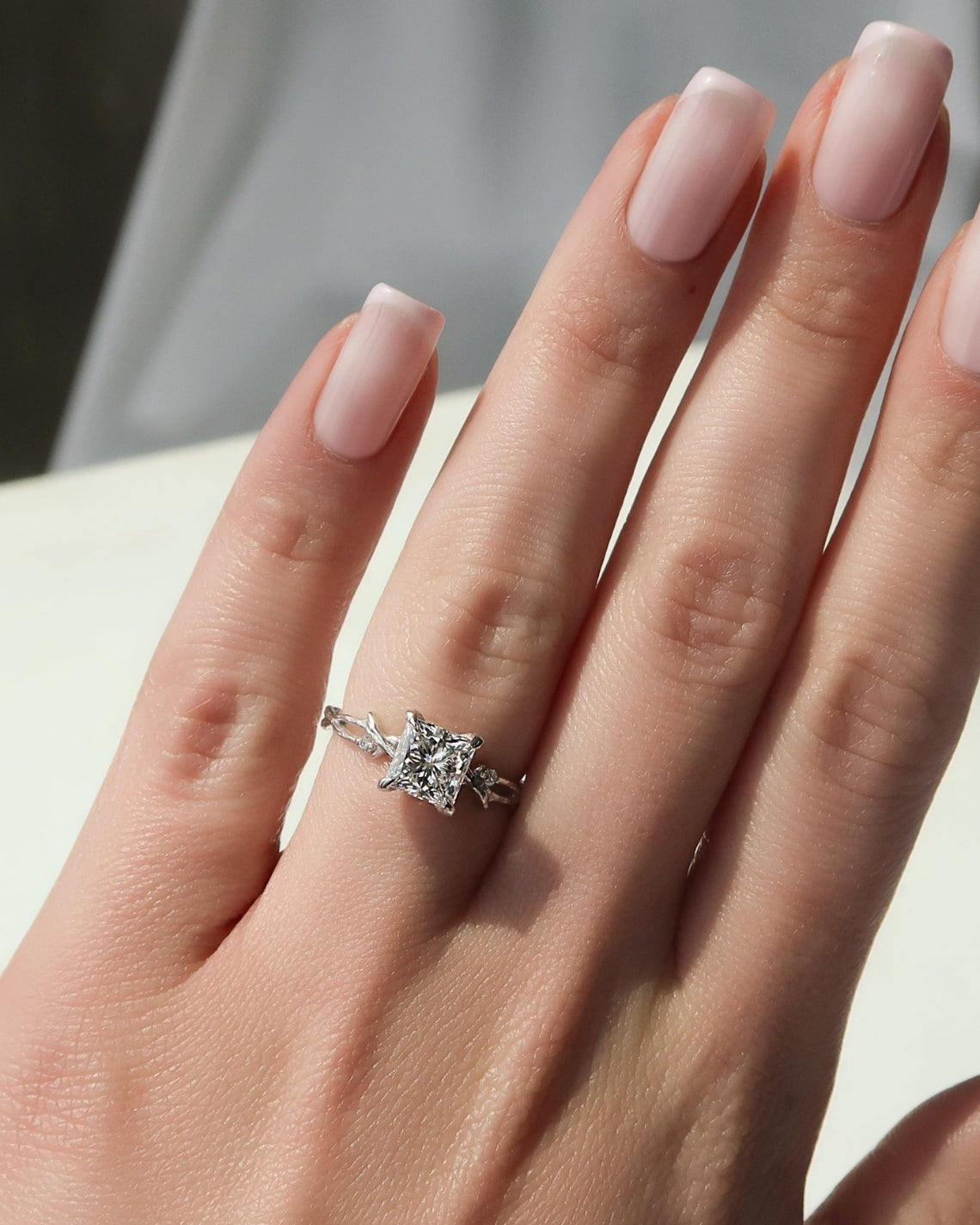 Princess cut CVD diamond engagement ring with twig-style band in white gold