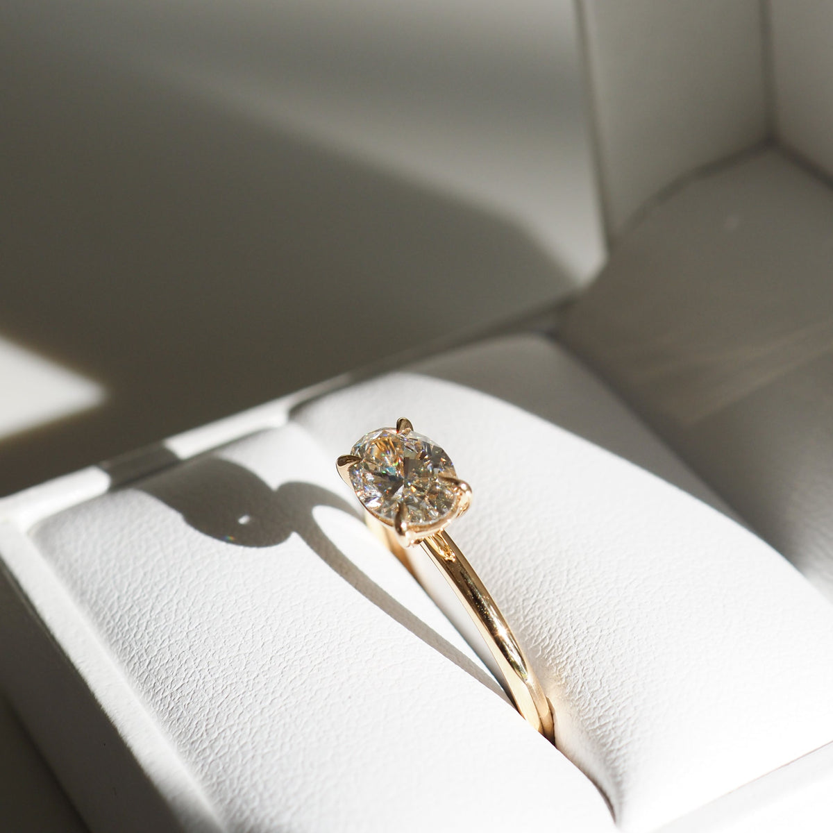 East-west elongated oval moissanite solitaire engagement ring in platinum setting, 1.0-3.0 carats