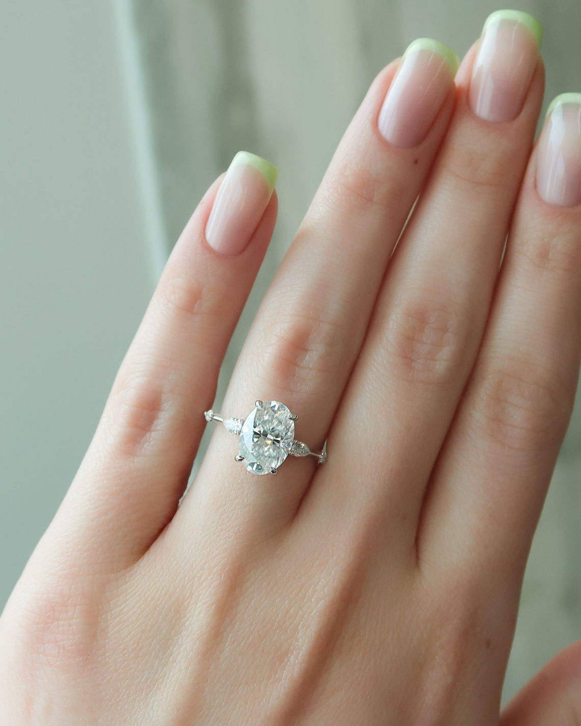 Oval cut CVD diamond hidden halo engagement ring in white gold setting