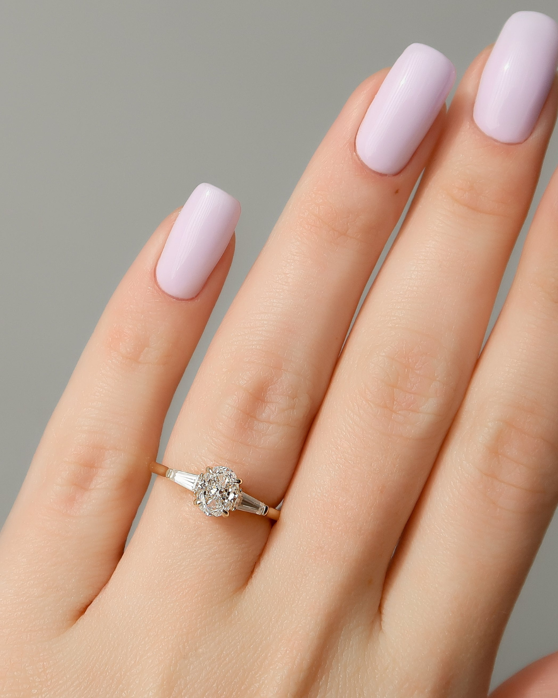 Oval cut CVD diamond three-stone engagement ring in white gold setting