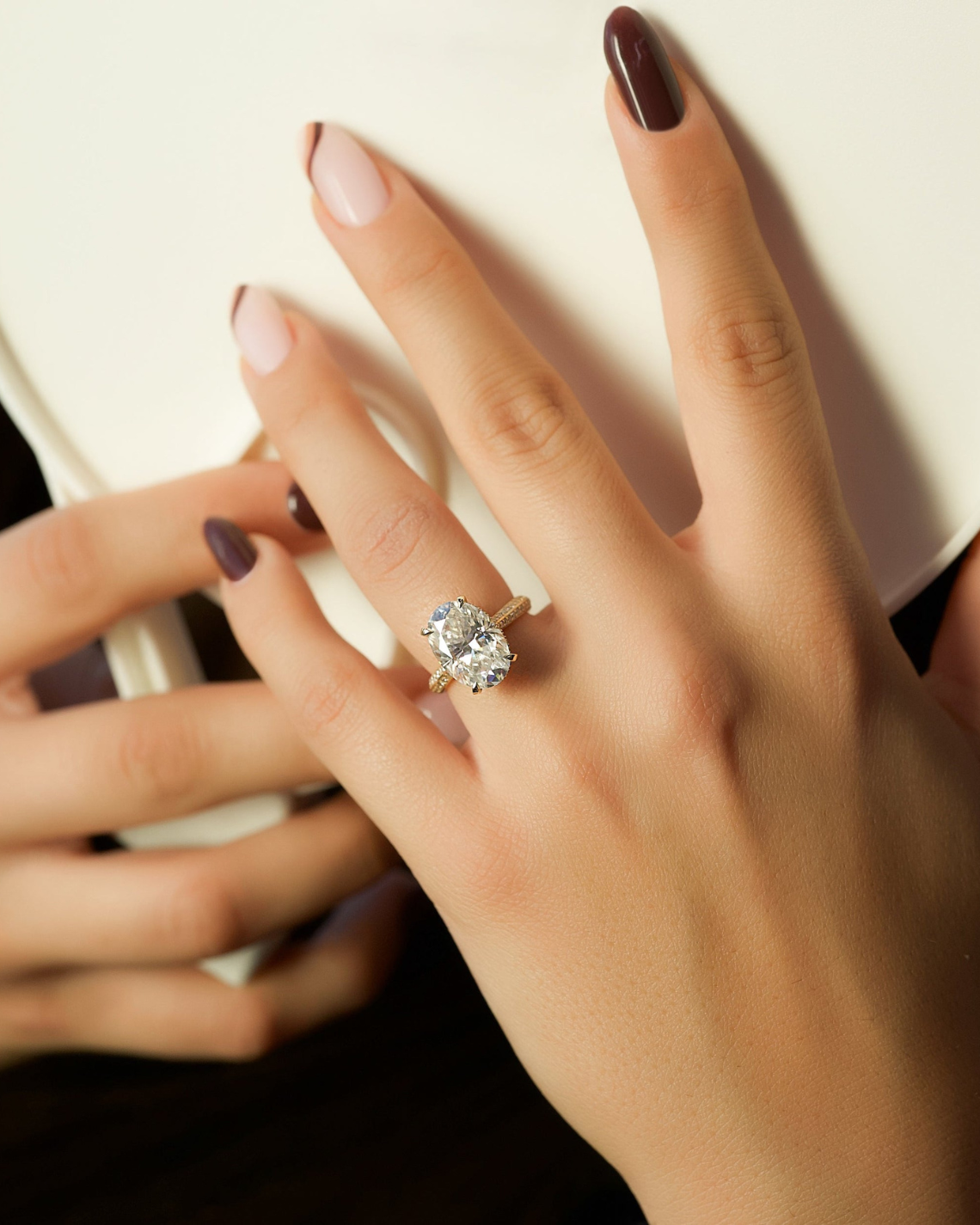 Oval cut CVD diamond hidden halo engagement ring with pave band in white gold setting
