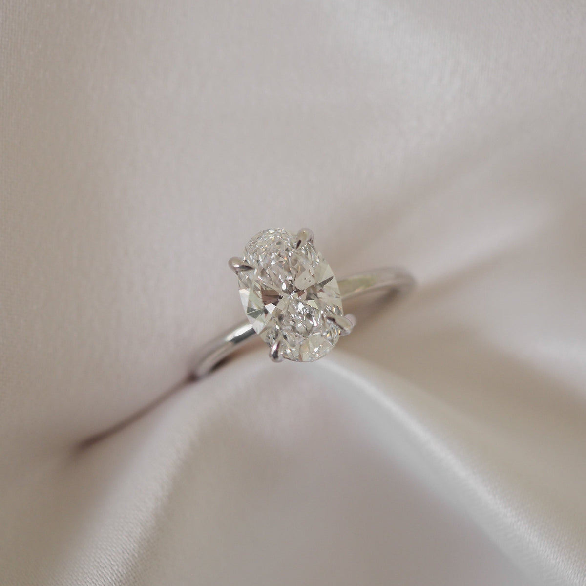Oval cut moissanite solitaire engagement ring setting in platinum, 1.5-2.5 CT