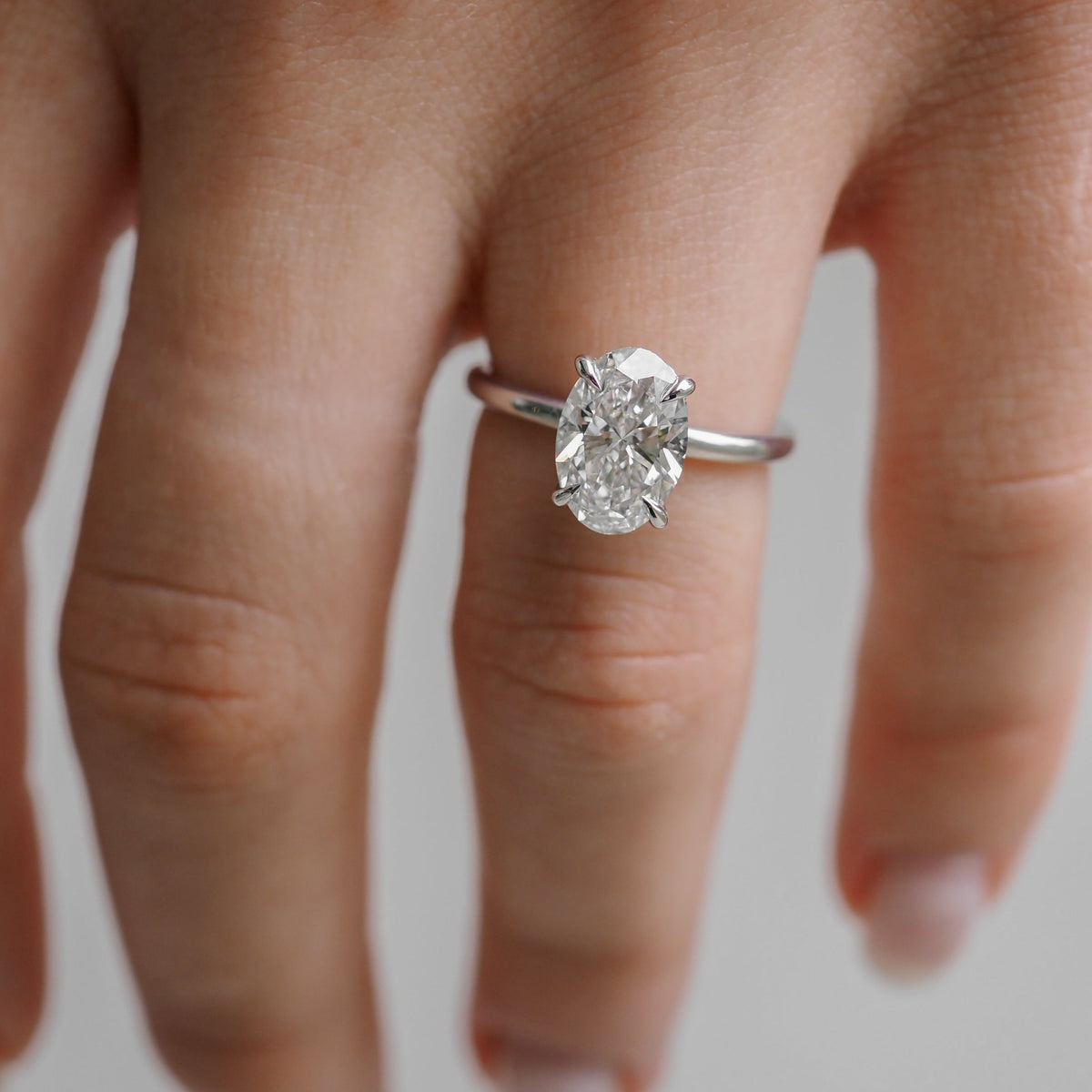 Oval cut moissanite solitaire engagement ring setting in platinum, 1.5-2.5 CT