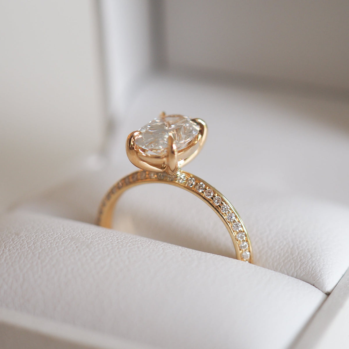 1.53 to 2.50 carat oval shaped lab-grown CVD diamond engagement ring with a shimmering pave setting in a modern elegant design

