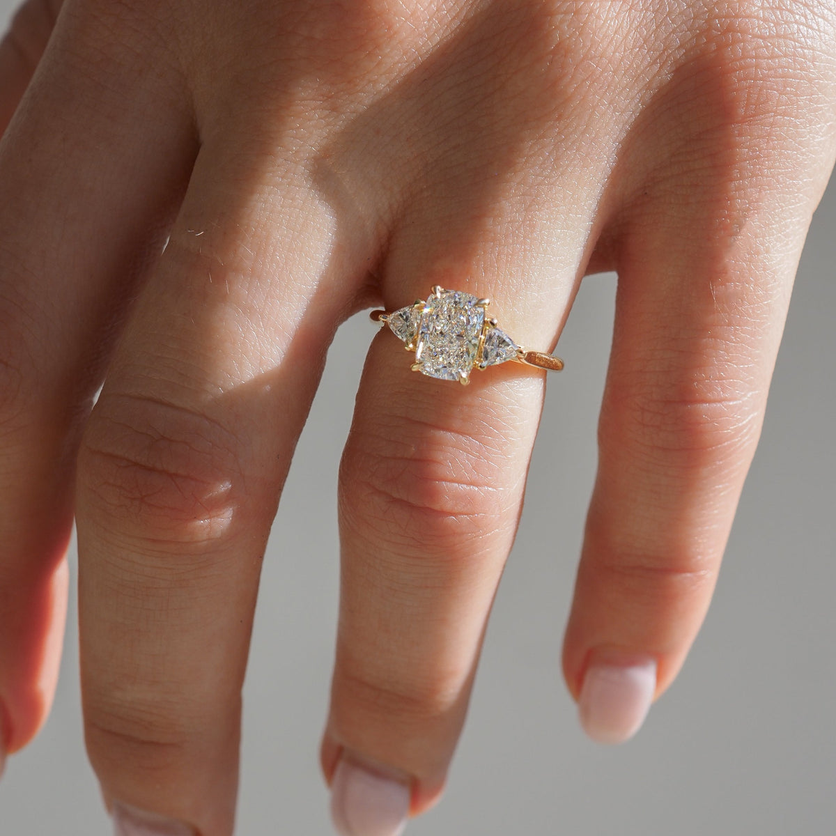 Cushion cut moissanite three-stone engagement ring in white gold setting, 1.40-2.50 CT

