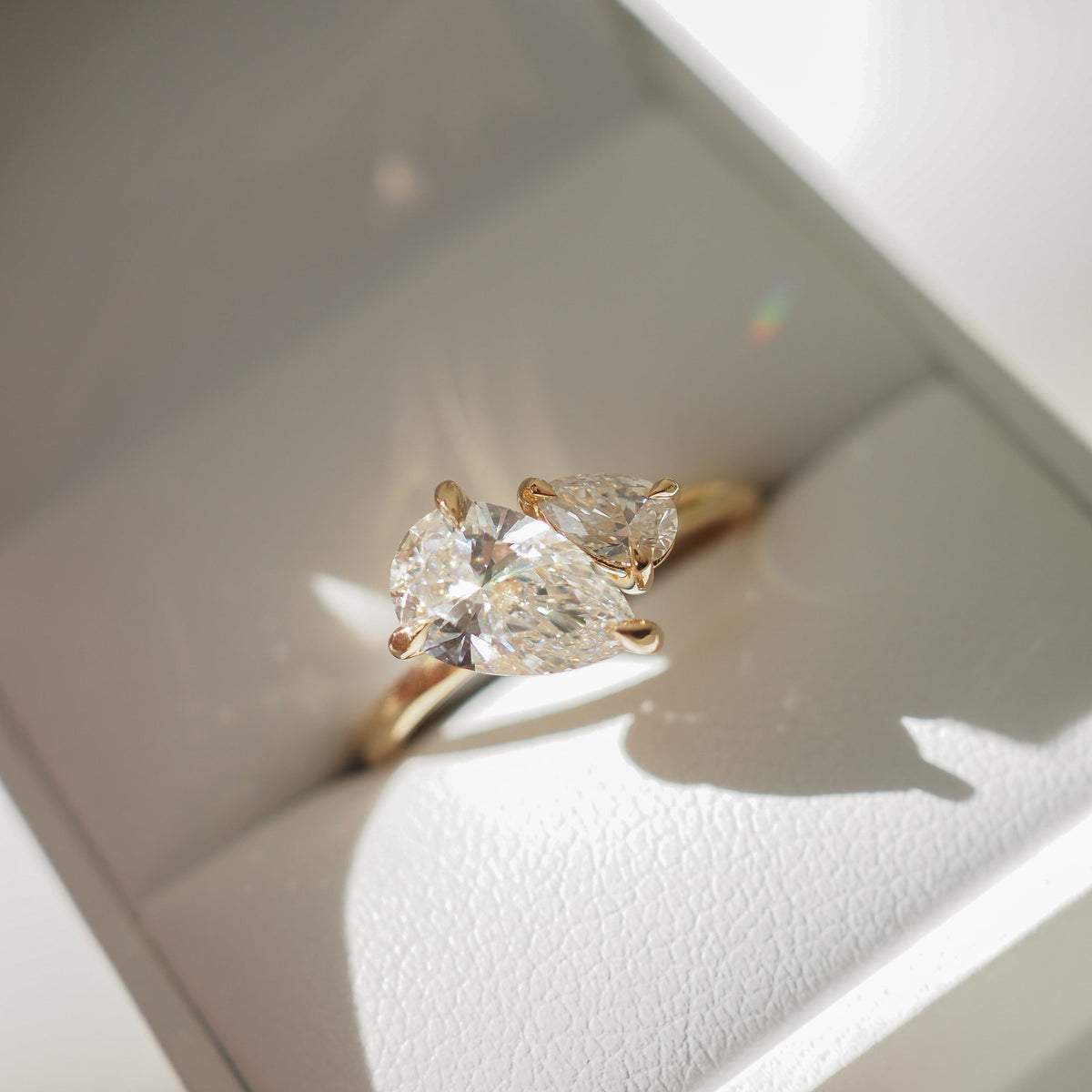 Pear cut moissanite two-stone engagement ring in platinum setting, 0.90-2.0 CT

