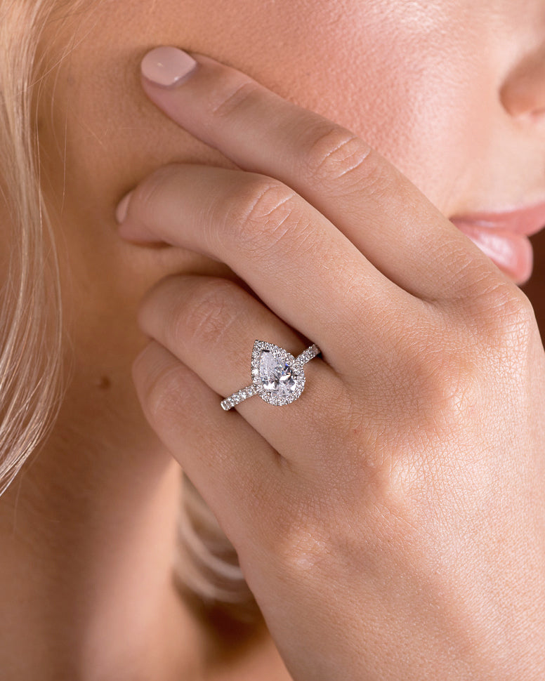 1.5–3.5 CT pear cut lab grown diamond engagement ring in gold, with halo and pave set diamonds for added brilliance and classic charm

