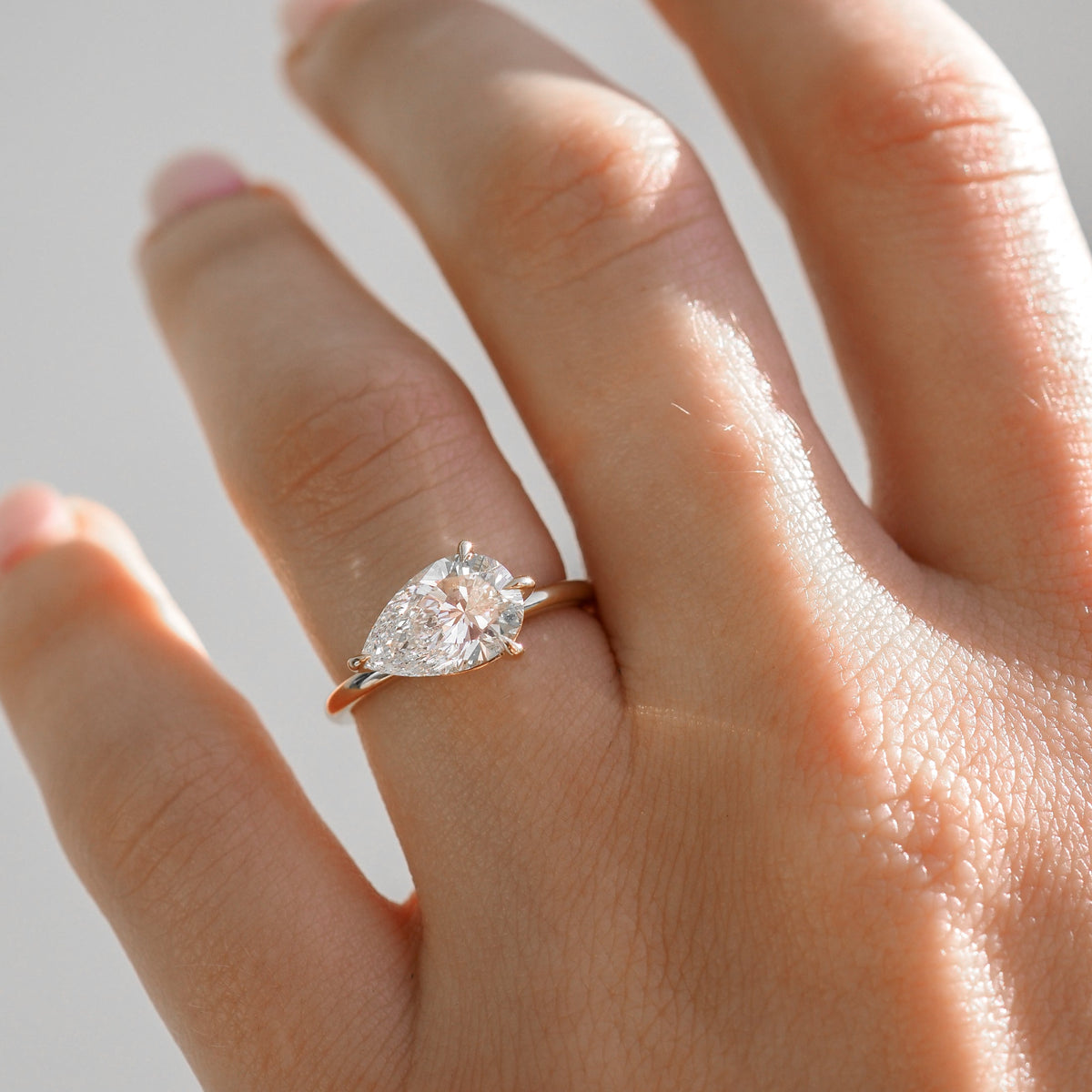 East-west pear shaped moissanite solitaire engagement ring in platinum setting, 2.0-4.0 carats