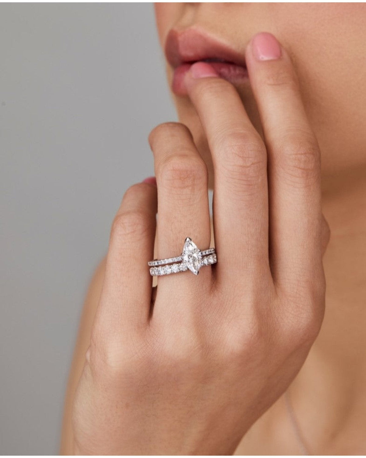 1.0–3.0 CT marquise cut lab grown diamond engagement ring in gold, featuring a slim pave band and a sharp, elongated center stone


