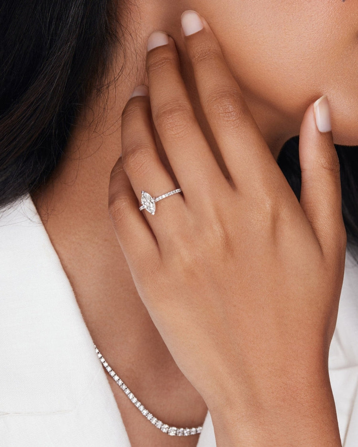 1.0–3.0 CT marquise cut lab grown diamond engagement ring in gold, featuring a slim pave band and a sharp, elongated center stone

