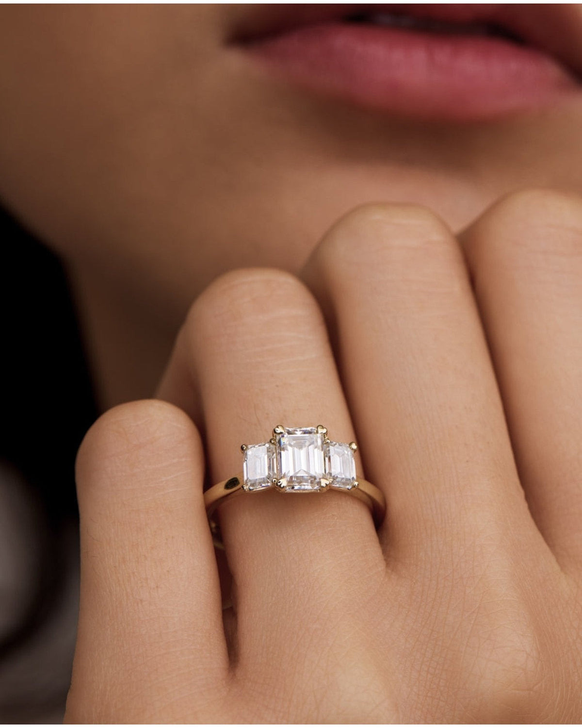 1.5–3.5 CT emerald cut lab grown diamond three stone engagement ring in gold, elegant step-cut center with matching side diamonds


