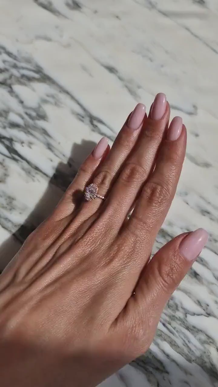 1.0–3.0 CT oval cut lab grown CVD diamond engagement ring featuring a sparkling halo and delicate pave band for added brilliance

